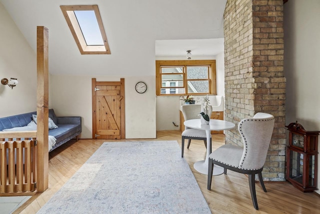 2710 N Hackett Ave, Milwaukee, WI 53211 - sitting room with lofted ceiling, a skylight, and wood finished floors