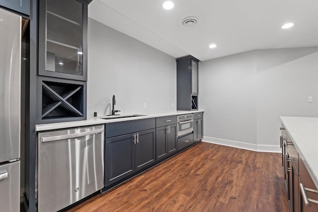 19750 Heron Pass, Brookfield, WI 53045 - kitchen featuring appliances with stainless steel finishes, a sink, dark wood-style flooring, light countertops, and baseboards