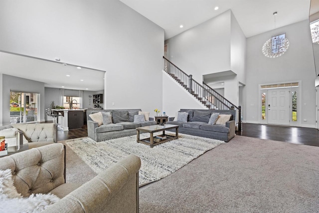 19750 Heron Pass, Brookfield, WI 53045 - living area with a high ceiling, recessed lighting, baseboards, dark wood-style flooring, and dark carpet