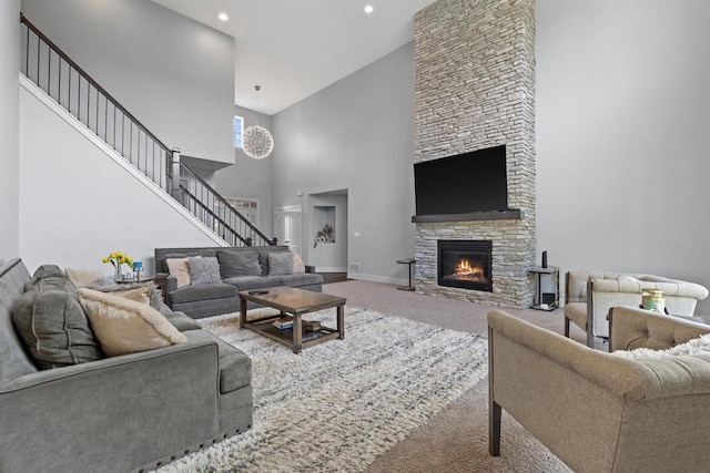19750 Heron Pass, Brookfield, WI 53045 - living room with carpet flooring, a fireplace, a towering ceiling, stairway, and baseboards