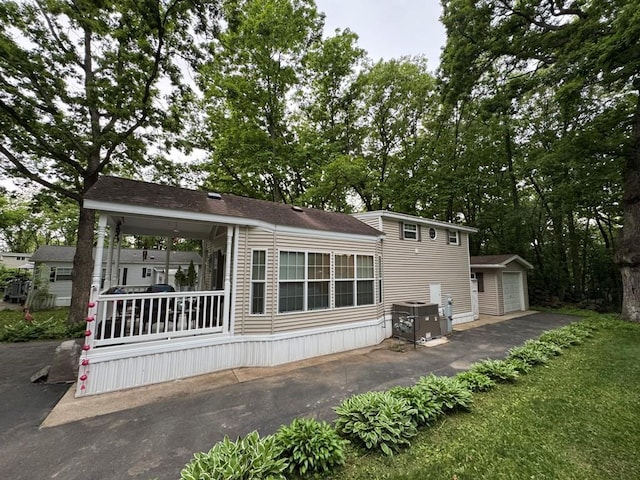 269 Oak Ln, Edgerton, WI 53534 - back of property featuring an outbuilding, central AC, and a detached garage