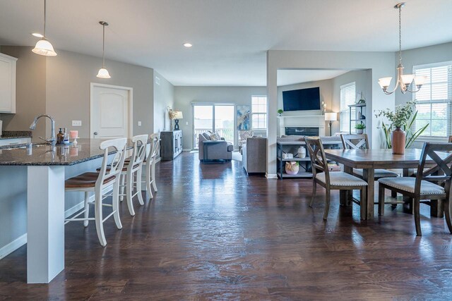 7236 N Beau Ave, Milwaukee, WI 53224 - dining room with plenty of natural light, dark wood-style flooring, a fireplace, and recessed lighting