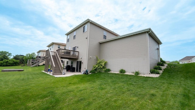 7236 N Beau Ave, Milwaukee, WI 53224 - back of property featuring stairway, a wooden deck, a lawn, and a patio area