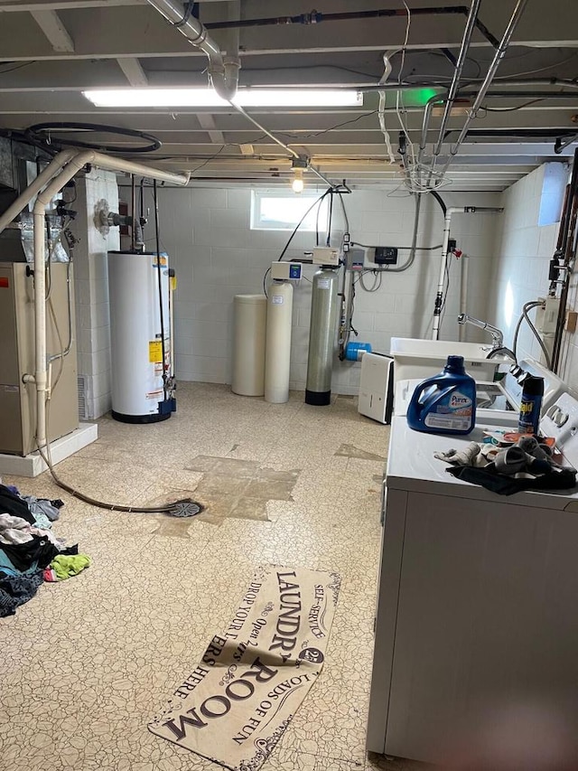 11312 Burlington Rd, Kenosha, WI 53144 - basement featuring water heater, a water softener system, heating unit, concrete block wall, and washing machine and clothes dryer