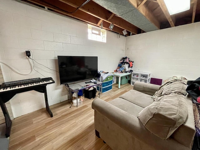 1522 Barlow St, La Crosse, WI 54601 - living area with wood finished floors and concrete block wall