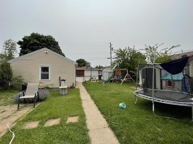 1522 Barlow St, La Crosse, WI 54601 - view of yard with a trampoline and a playground
