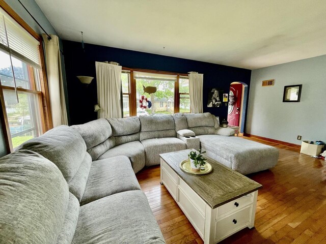 1522 Barlow St, La Crosse, WI 54601 - living room featuring arched walkways and wood finished floors