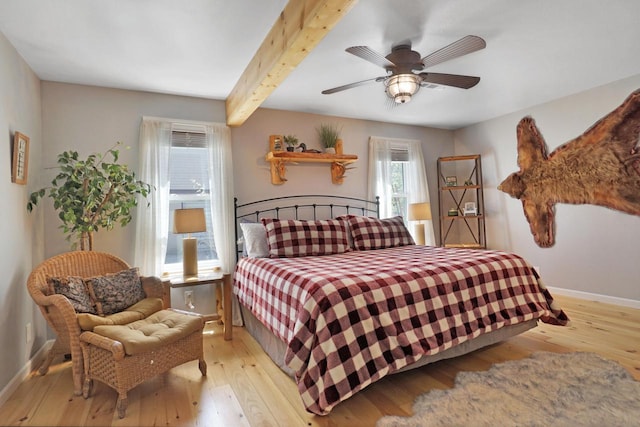 1014 Long Bow Ct, Nekoosa, WI 54457 - bedroom featuring light wood-style floors, baseboards, beamed ceiling, and ceiling fan