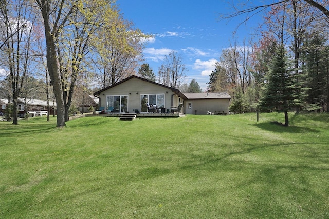 1014 Long Bow Ct, Nekoosa, WI 54457 - back of house featuring a lawn and a wooden deck
