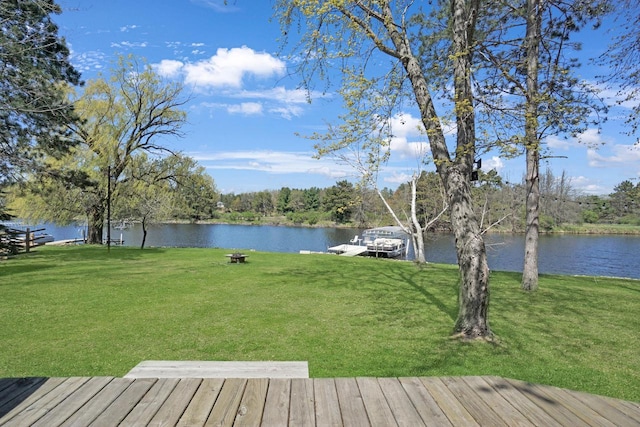 1014 Long Bow Ct, Nekoosa, WI 54457 - wooden deck featuring a water view, a boat dock, and a lawn