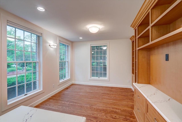 2818 Marshall Ct, Madison, WI 53705 - unfurnished dining area featuring light wood finished floors, baseboards, and recessed lighting