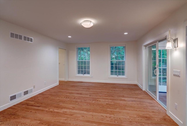 2818 Marshall Ct, Madison, WI 53705 - empty room with light wood finished floors, baseboards, and recessed lighting