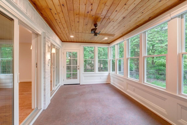 2818 Marshall Ct, Madison, WI 53705 - unfurnished sunroom with wooden ceiling, a ceiling fan, carpet floors, and baseboards