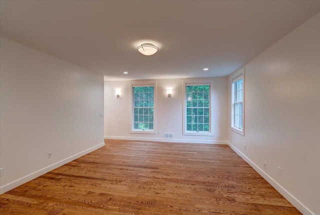 2818 Marshall Ct, Madison, WI 53705 - spare room featuring light wood-style flooring, baseboards, and recessed lighting