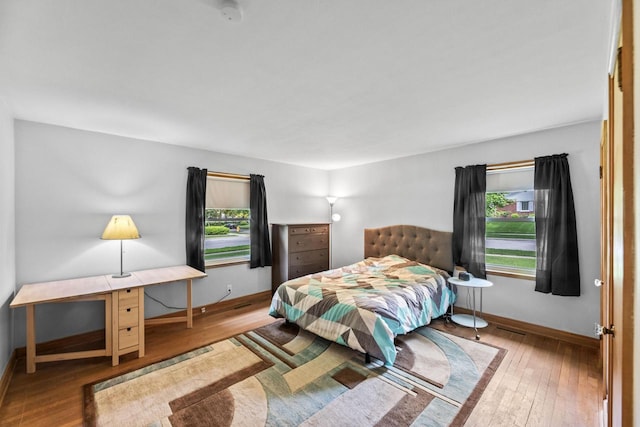 519 S Charles St, Waukesha, WI 53186 - bedroom with baseboards and wood-type flooring