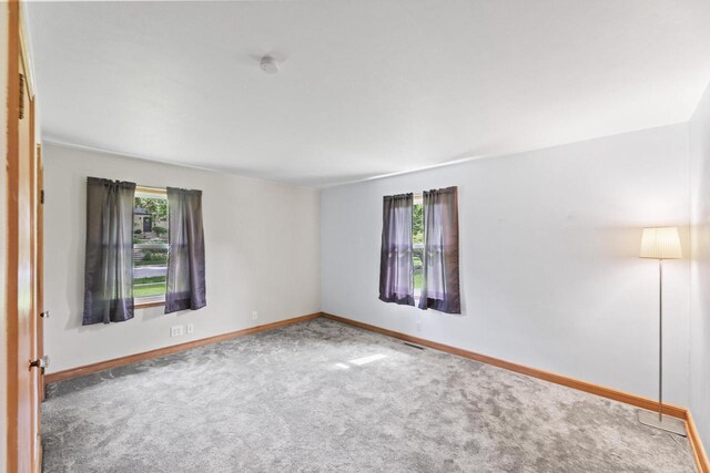 519 S Charles St, Waukesha, WI 53186 - empty room featuring carpet flooring, baseboards, and a smoke detector