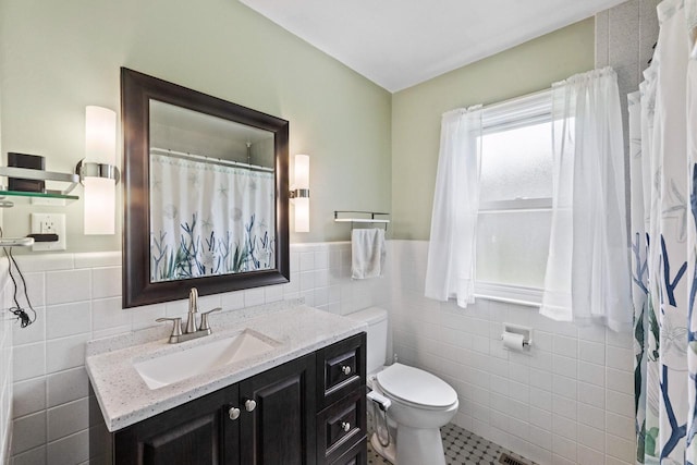 519 S Charles St, Waukesha, WI 53186 - full bathroom featuring tile walls, vanity, toilet, wainscoting, and tile patterned floors