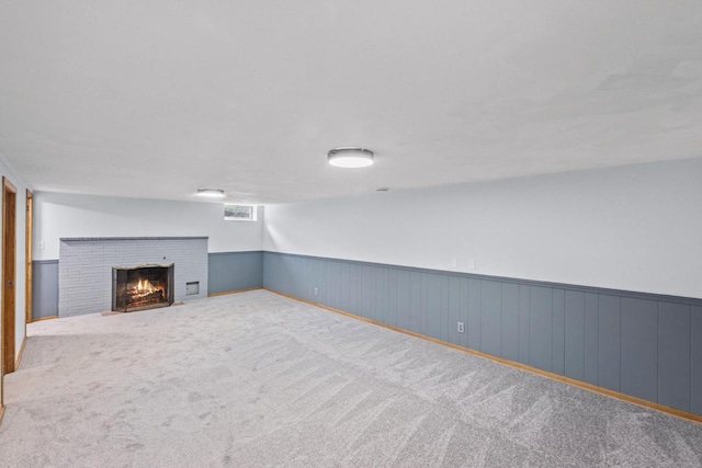519 S Charles St, Waukesha, WI 53186 - below grade area with a wainscoted wall, a fireplace, and carpet flooring