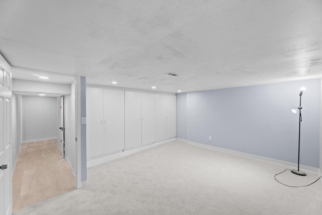 519 S Charles St, Waukesha, WI 53186 - finished below grade area featuring light carpet, baseboards, and recessed lighting