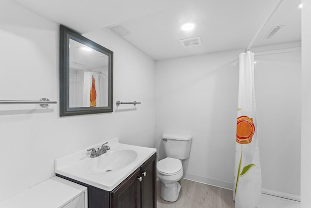 519 S Charles St, Waukesha, WI 53186 - full bathroom featuring vanity, toilet, wood finished floors, baseboards, and curtained shower