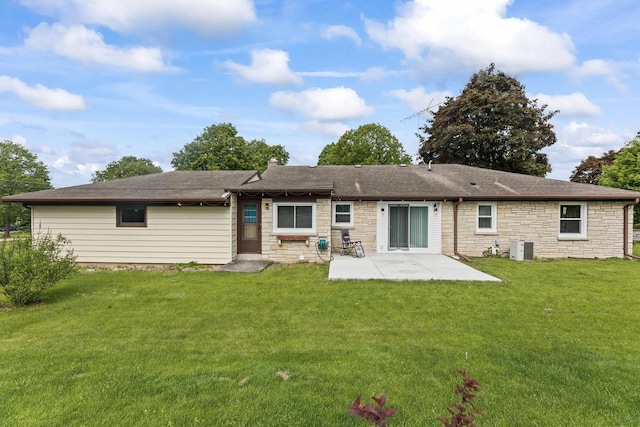 519 S Charles St, Waukesha, WI 53186 - back of house featuring a patio area, stone siding, a yard, and central AC unit