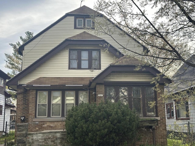 3747 N Vel R Phillips Ave, Milwaukee, WI 53212 - view of front facade featuring roof with shingles and brick siding