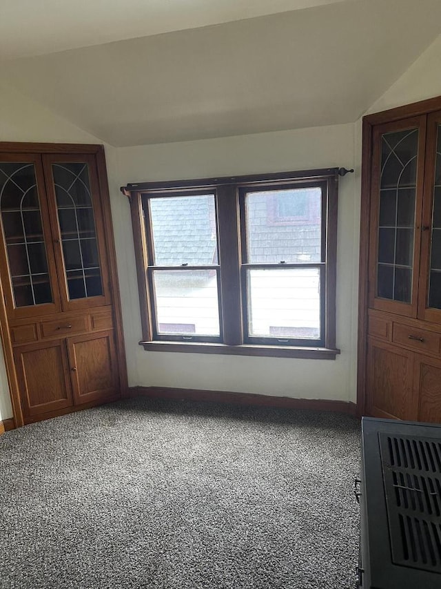 3747 N Vel R Phillips Ave, Milwaukee, WI 53212 - empty room featuring plenty of natural light, baseboards, vaulted ceiling, and carpet