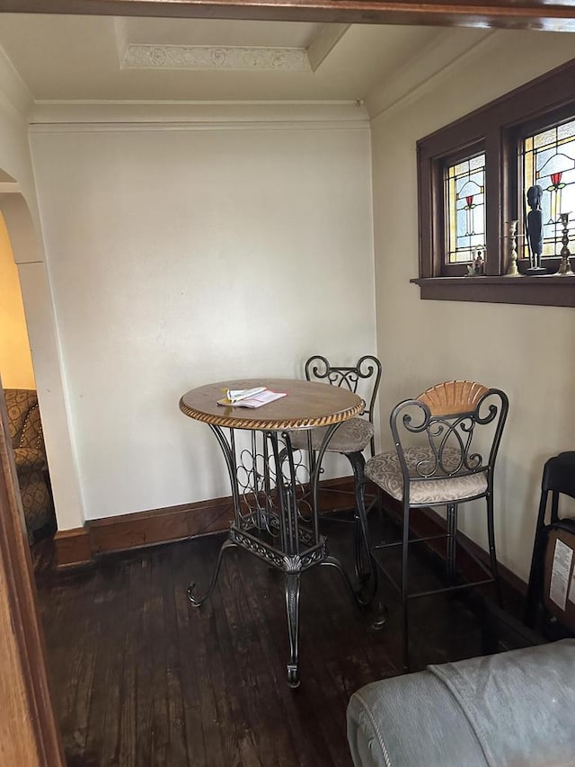 3747 N Vel R Phillips Ave, Milwaukee, WI 53212 - dining space featuring baseboards, arched walkways, wood-type flooring, and ornamental molding