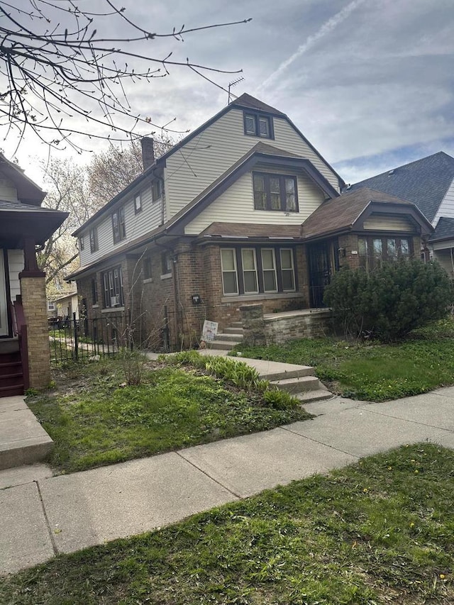 3747 N Vel R Phillips Ave, Milwaukee, WI 53212 - view of front of house featuring a chimney and brick siding