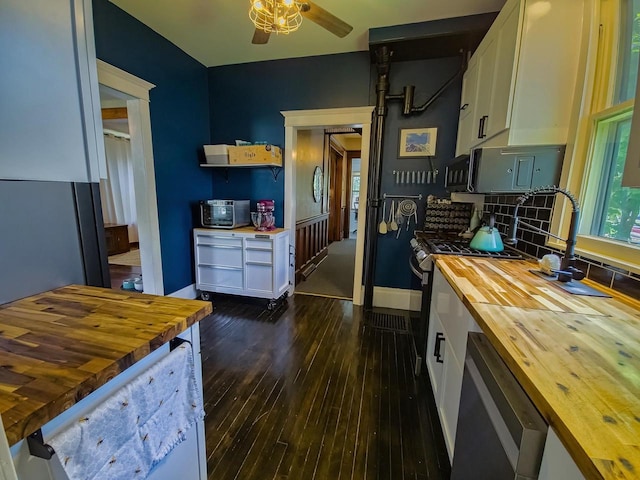 318 E Mary St, Darlington, WI 53530 - kitchen with butcher block counters, open shelves, white cabinets, and dark wood-style flooring
