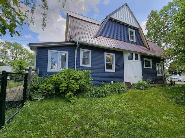 318 E Mary St, Darlington, WI 53530 - rear view of property with metal roof, a gambrel roof, and a gate
