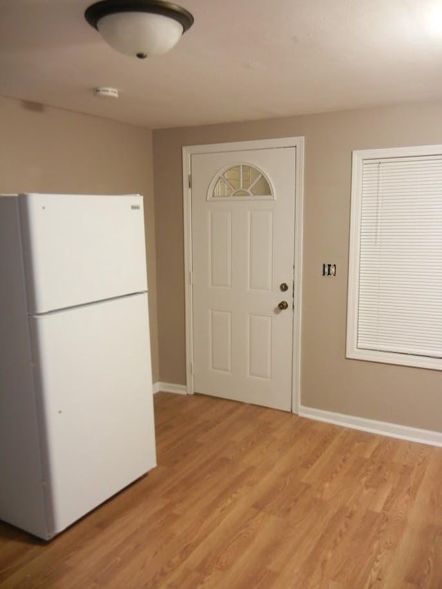 506 E Cook St, Portage, WI 53901 - entrance foyer featuring light wood-style flooring and baseboards