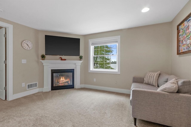 3155 W Lake Helen Dr, Rosholt, WI 54473 - living room with baseboards, a glass covered fireplace, and carpet