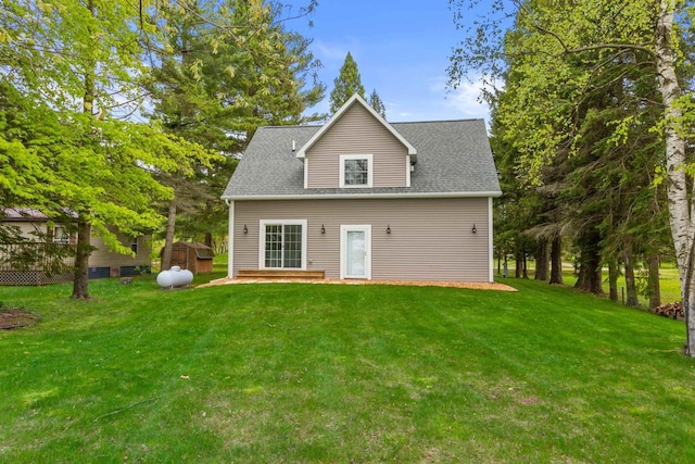 3155 W Lake Helen Dr, Rosholt, WI 54473 - back of property featuring a lawn and a shingled roof