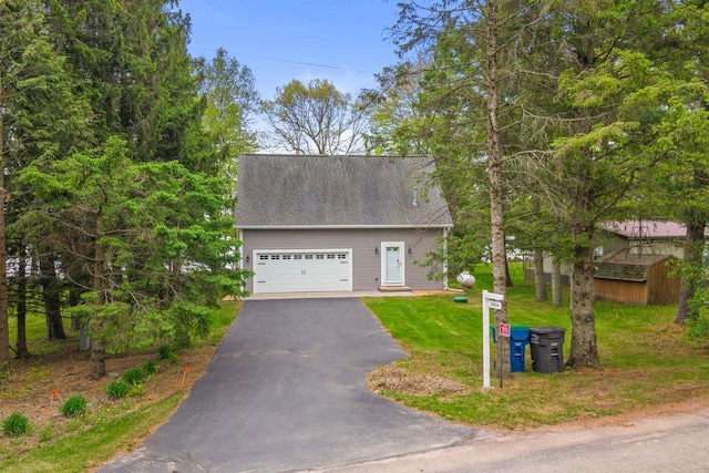 3155 W Lake Helen Dr, Rosholt, WI 54473 - cape cod home with a garage and a front yard