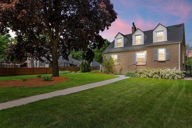 214 E Bolivar Ave, Milwaukee, WI 53207 - property exterior at dusk featuring a chimney and brick siding
