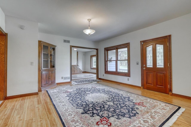 W1041 County Road O, Oconomowoc, WI 53066 - foyer entrance with light wood-style flooring and baseboards