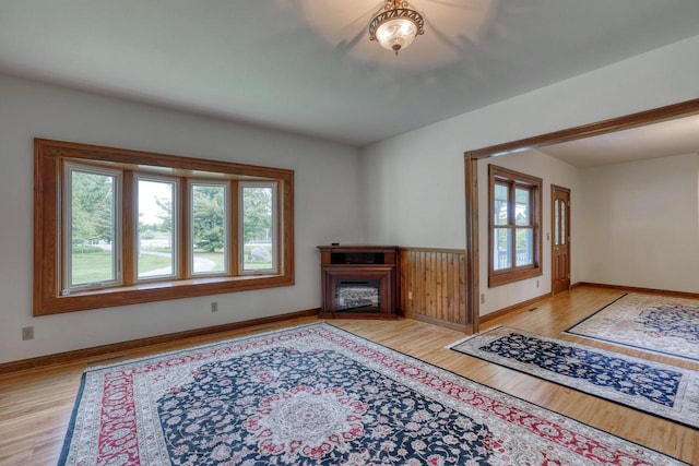W1041 County Road O, Oconomowoc, WI 53066 - living room with healthy amount of natural light, light wood-style flooring, and baseboards