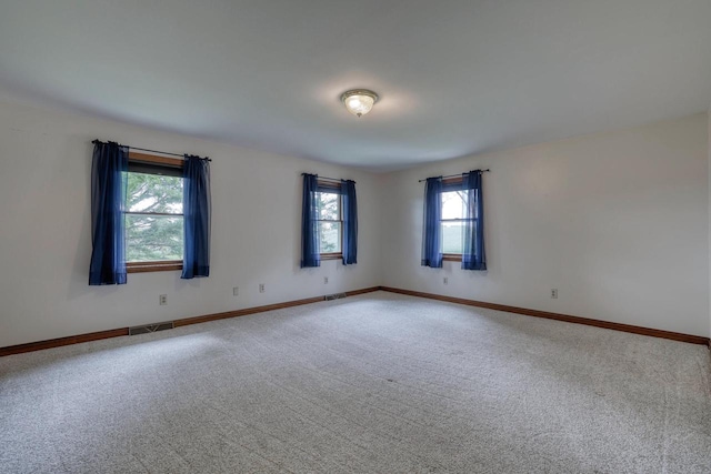W1041 County Road O, Oconomowoc, WI 53066 - spare room with carpet floors and baseboards