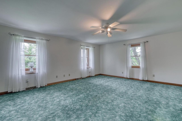 W1041 County Road O, Oconomowoc, WI 53066 - unfurnished room featuring ceiling fan, carpet floors, and baseboards