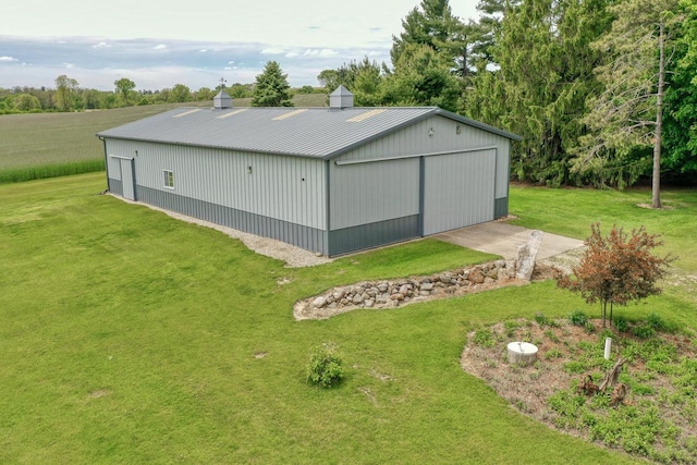 W1041 County Road O, Oconomowoc, WI 53066 - view of pole building with a yard