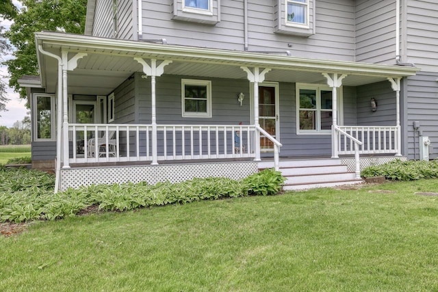 W1041 County Road O, Oconomowoc, WI 53066 - view of front of house featuring a porch and a front lawn