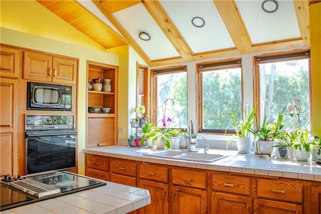 18845 64th Ave, Chippewa Falls, WI 54729 - kitchen featuring black appliances, a sink, healthy amount of natural light, and brown cabinetry