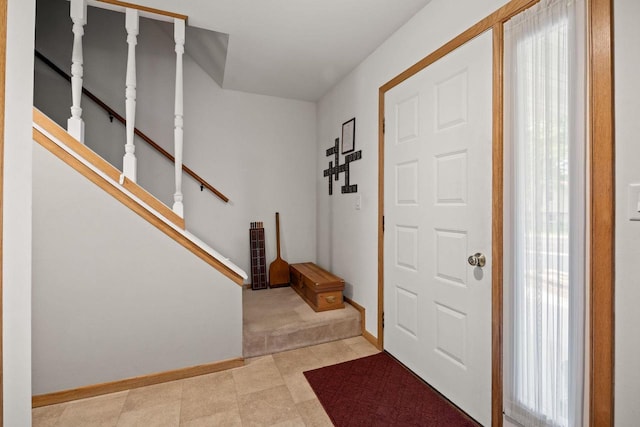 417 Raintree Dr, Fort Atkinson, WI 53538 - foyer with light colored carpet and stairway