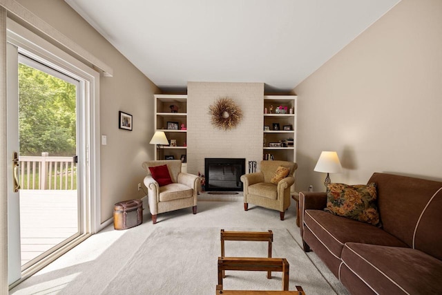 417 Raintree Dr, Fort Atkinson, WI 53538 - living area featuring light carpet and a brick fireplace