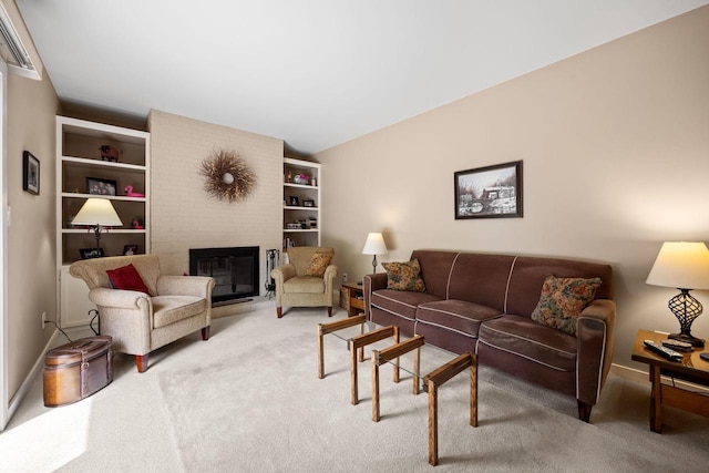 417 Raintree Dr, Fort Atkinson, WI 53538 - carpeted living room with a fireplace and baseboards