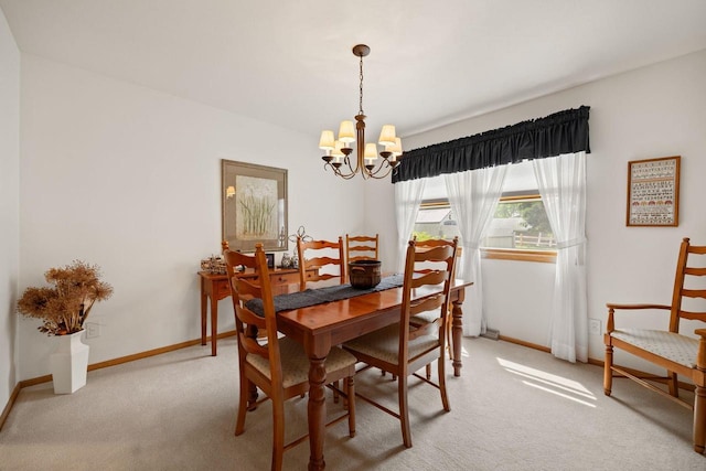 417 Raintree Dr, Fort Atkinson, WI 53538 - dining space featuring a chandelier and light carpet
