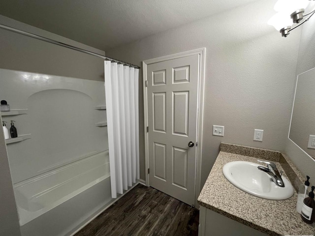 620 E Maple Beach Dr, Edgerton, WI 53534 - bathroom with shower / bath combo with shower curtain, wood finished floors, and vanity