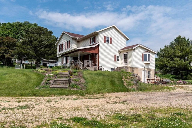 4884 Brewery Rd, Cross Plains, WI 53528 - rear view of house with a garden and a yard