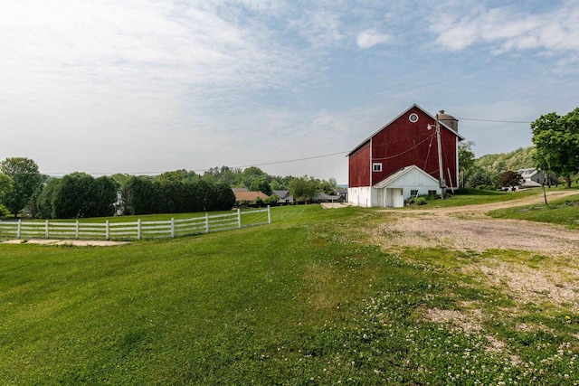 4884 Brewery Rd, Cross Plains, WI 53528 - view of yard with a barn, dirt driveway, an outdoor structure, and a detached garage